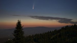 Comet NEOWISE in the sky at sunset